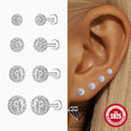 Silver earrings with clear gemstones displayed on a white background, shown on an ear, and with a '925' stamp.